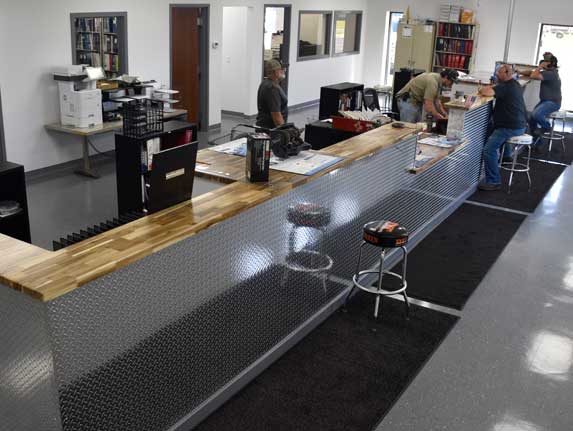 a group of people working at a counter